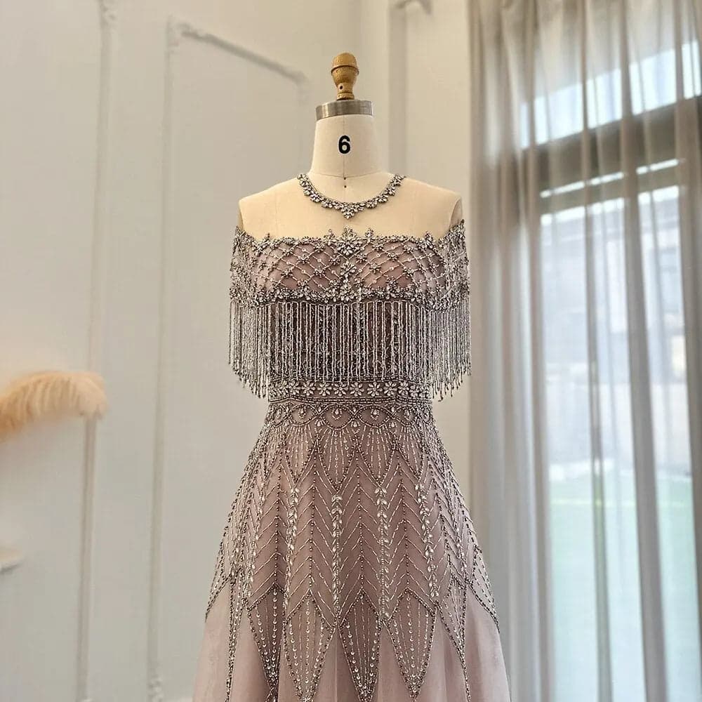 فستان سهرة وردي فاتح مزين بالخرز اليدوي والشراشيب SS061